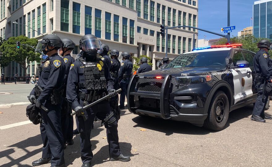 Police officers monitor a protest in downtown San Diego, May 31, 2020.