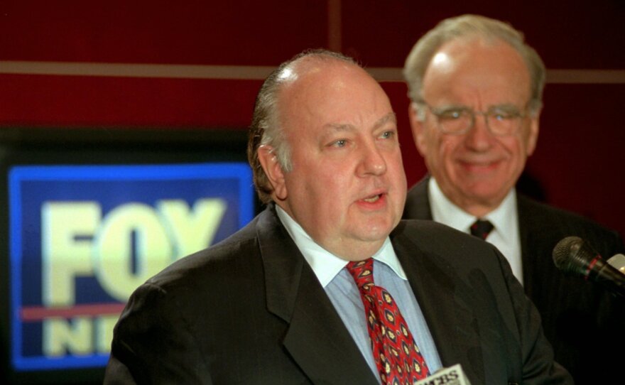 Roger Ailes (left) speaks at a news conference with Rupert Murdoch in January 1996 after it was announced Ailes would be chairman and CEO of Fox News.