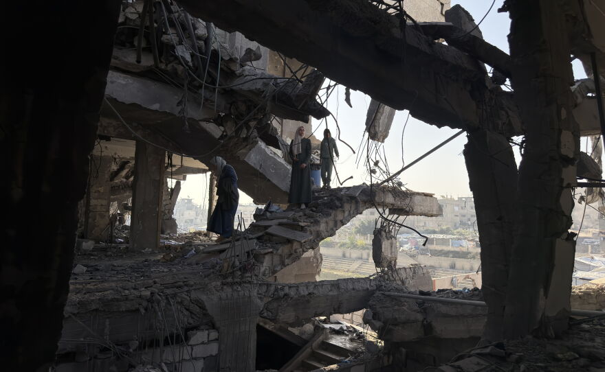 People inspect the aftermath of a deadly Israeli airstrike that destroyed a home in Gaza City six weeks into the ceasefire on Nov. 20, 2025.