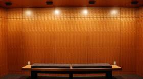 An empty lobby bench awaits theatergoers in The Old Globe's Viterbi Family Lobby, in an undated photo. 