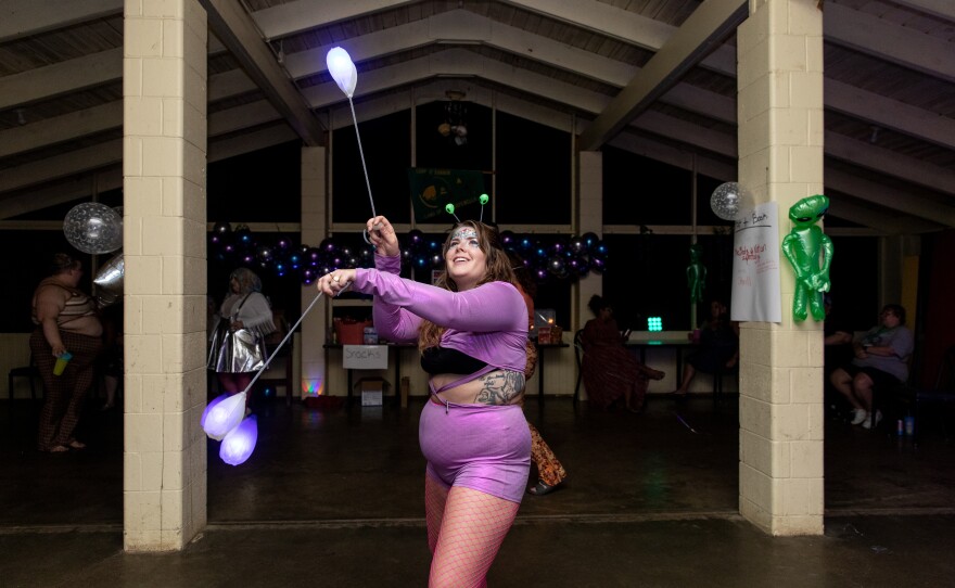 Cat Ruehlman, 32, poi dances during Camp Roundup's space-disco party.