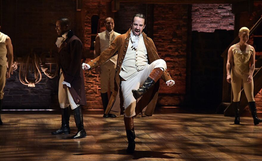Actor and composer Lin-Manuel Miranda (center) performs on stage during a rehearsal of Hamilton ahead of the Grammy Awards in February in New York City.
