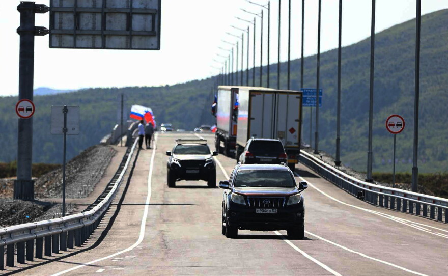 In this photo released by the Government of Primorsky Krai Region on Monday, Sept. 7, 2026, vehicles drive across the new bridge between Russia and North Korea named after the Soviet officer Yakov Novichenko, who is credited with saving North Korea's founding leader, Kim Il-sung, over the Tumannaya River in Primorsky Krai Region of Russia.