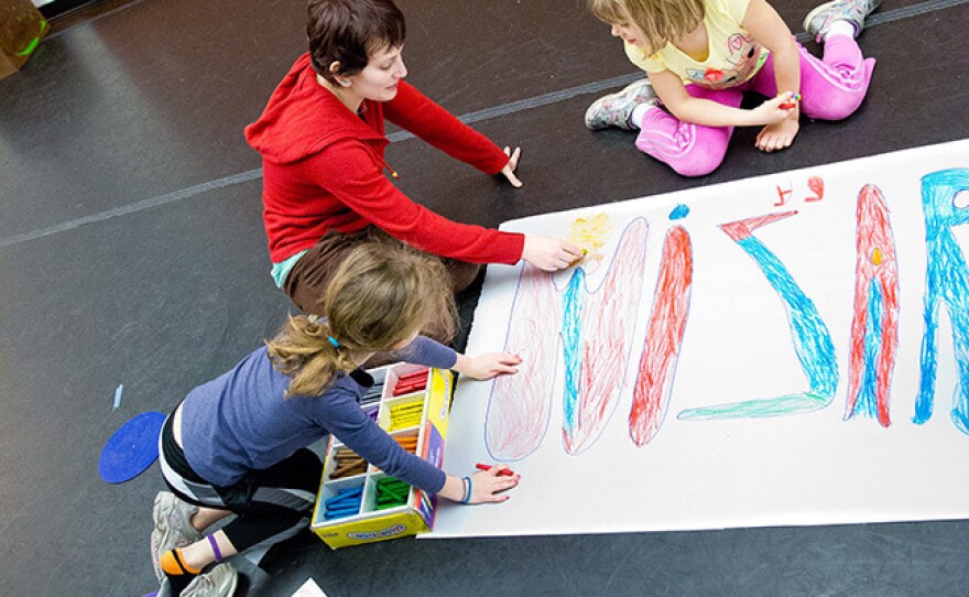 Assistant teacher Charlotte Lang Bush draws with children at Imagination Stage in Bethesda, Md. Staff members and some students at the children's theater and arts center have taken the Torrance Test to measure their creativity.