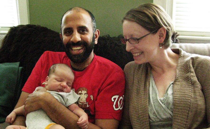 Kumar Chandran and Elanor Starmer with their son Kailas Chandran. Their friends are envious of Kumar Chandran's paid paternity leave.