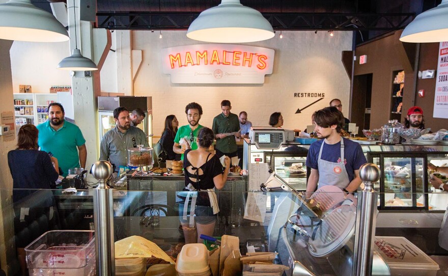 The takeout counter at Mamaleh's Delicatessen in Cambridge, Mass. The restaurant recently implemented revenue sharing, where a percentage of sales is funneled to kitchen workers.