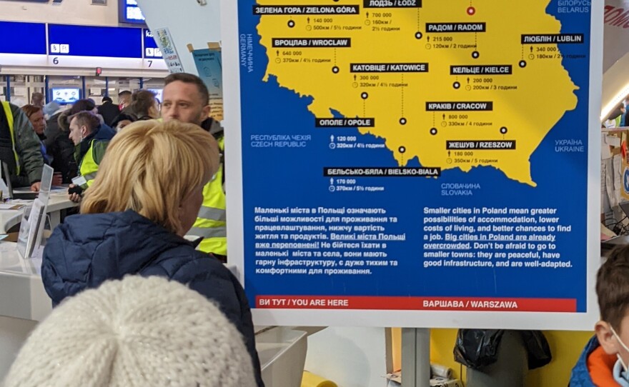 "Big cities in Poland are already overcrowded. Don't be afraid to go to smaller towns: they are peaceful, have good infrastructure, and are well-adapted," said a sign in Warsaw's train station.