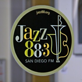 The logo of KSDS Jazz 88.3 is shown on a glass station door on August 5, 2025.