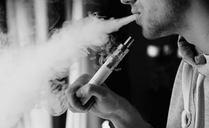 A person is shown smoking an e-cigarette in this undated file photo.