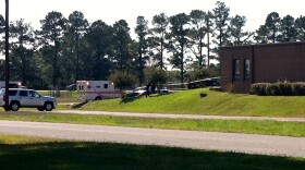 Ambulances respond to shooting at National Guard Armory near Naval Support Activity Midsouth.