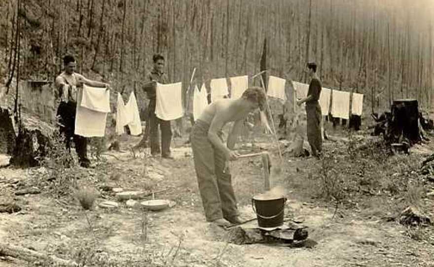 Clothes get washed and dried at a CCC camp near Apgar, Mont., at the foot of Lake McDonald in Glacier National Park.