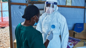 Health workers interact at the Evangelical Medical Center, in Bunia, eastern Congo, Friday, July 3, 2026, where Ebola clinical trials are scheduled to take place.