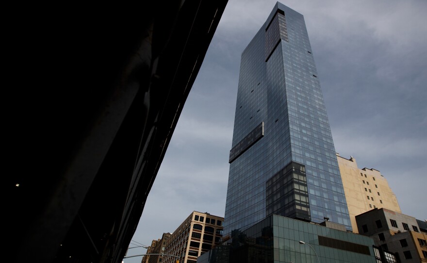 Trump SoHo Hotel Condominium looms over its neighborhood of Hudson Square in lower Manhattan.