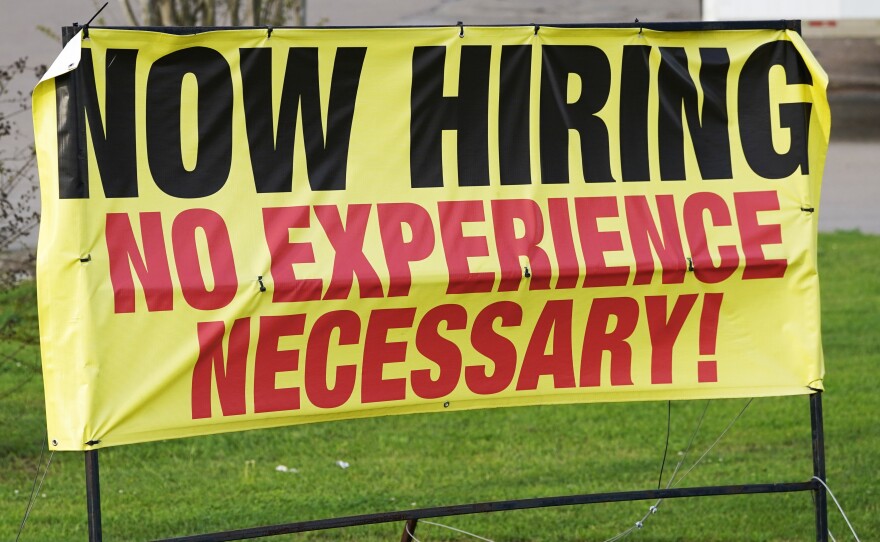 Help wanted signs such as this one outside a retailer in Hattiesburg, Miss., on March 27, 2021, were a common sight last year as busineses struggled to recruit workers.