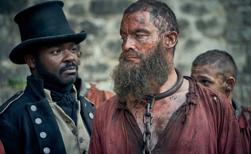 Javert (DAVID OYELOWO) and Jean Valjean (DOMINIC WEST)