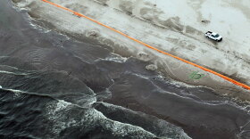 Efforts to clean the beach in Elmer's Island, La., were stopped Tuesday due to bad weather created by Tropical Storm Alex.