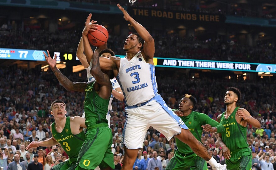 North Carolina's Kennedy Meeks (3) of the and Jordan Bell (1) of the Oregon get tangled up during the Final Four Semifinal.