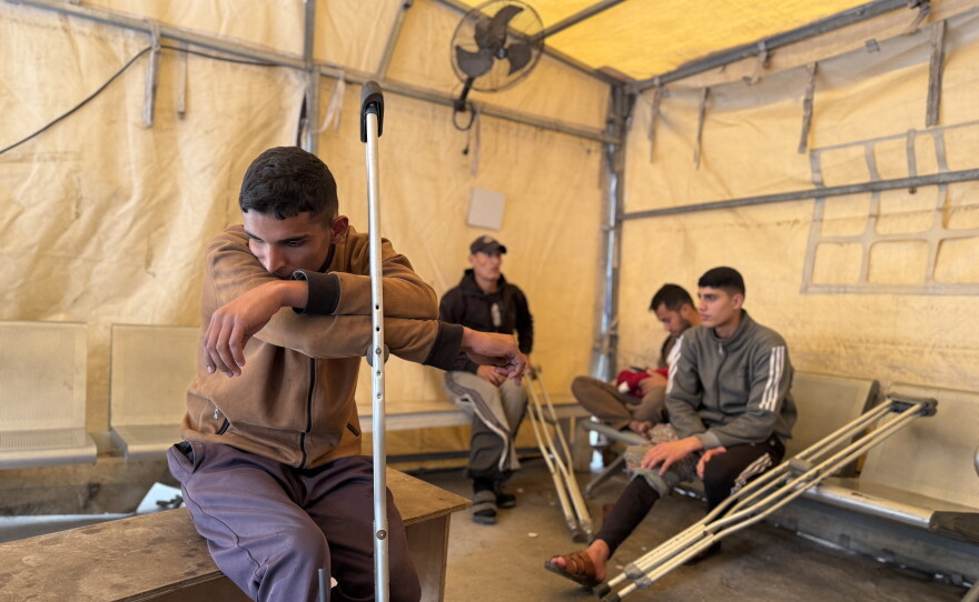 Patients sit in a clinic run by Doctors Without Borders in Gaza City on Dec. 31, 2025, a day before Israel banned more than 40 international aid organizations from bringing in staff or aid to Gaza.