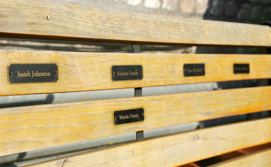 In The NET's schoolyard, a memorial bench to students who have lost their lives.