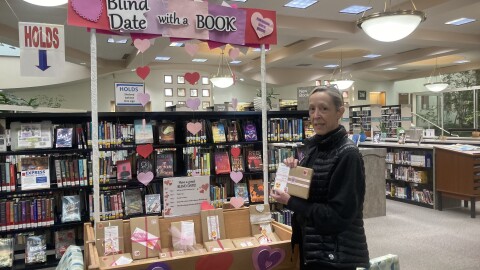 Rancho Penasquitos Library Branch Manager Adrianne Peterson standing near a Valentines Day display.