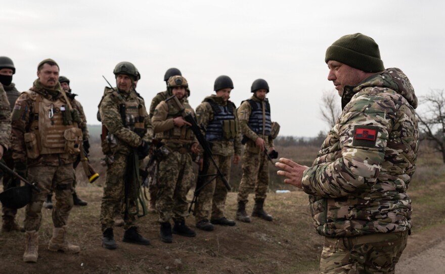 A commander from the Ukrainian 63rd brigade debriefs following a military training in Mykolaiv on Wednesday, in preparation for a counteroffensive to recapture Kherson.