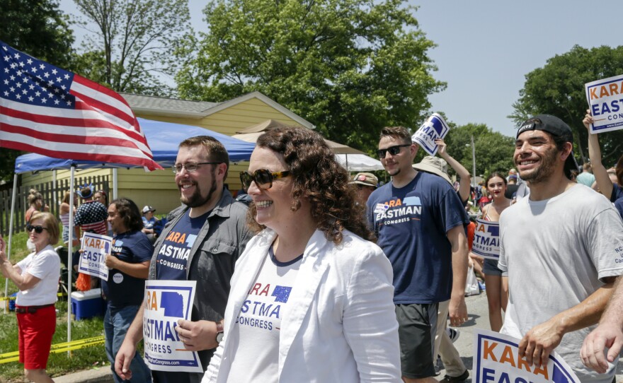 Democratic House candidate Kara Eastman participates in a 4th of July parade in Ralston, Neb. Women Democratic House candidates like Eastman are generally being significantly outraised by their male Democratic counterparts.