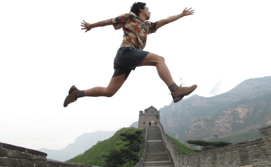 Zola leaps symbolically across the Great Wall of China.