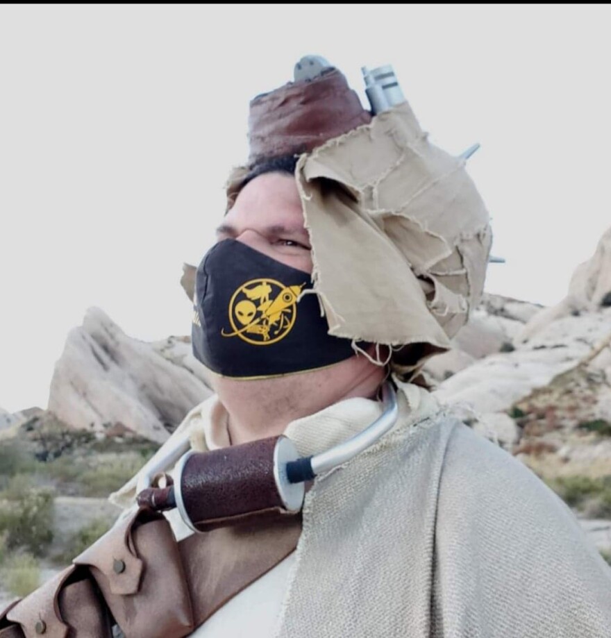 Shawn Mullen relaxing in his Tusken Raider cosplay.