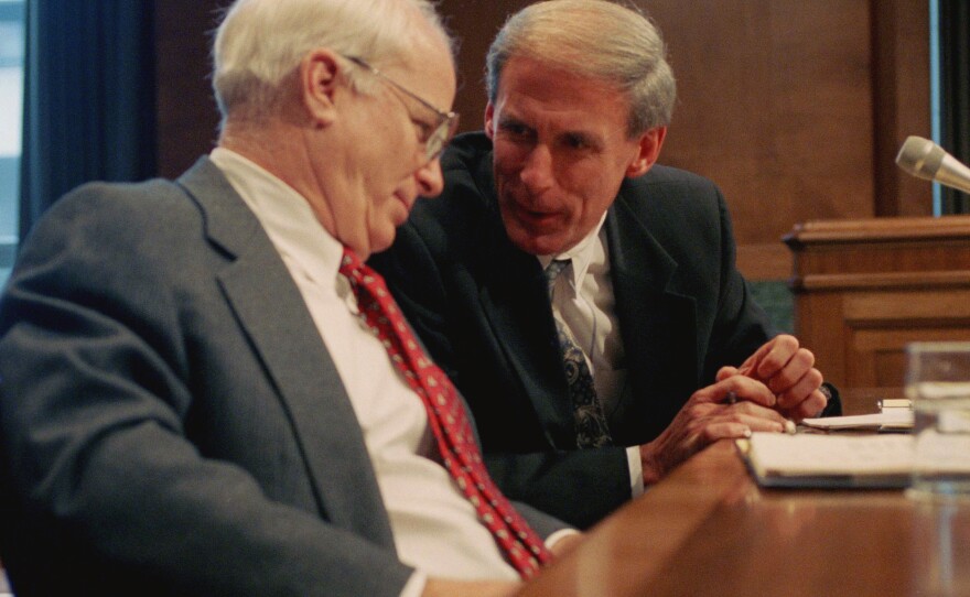 Sen. Dan Coats, right, talks with Sen. John S. McCain prior to testifying before a Senate Budget Committee hearing in  1995.