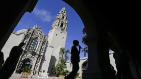 A boy walks past the Museum of Man in Balboa Park, Oct. 2, 2013. 