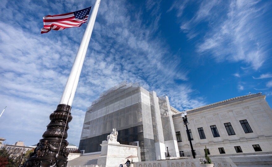 An American flag is seen outside the Supreme Court, in Washington, D.C., in November. This week, the high court will hear oral arguments for a case that could change who gets to be a U.S. citizen.
