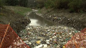 Trash fills a binational waterway in the Tijuana River Valley near the San Diego-Mexico border, Jan. 5, 2016.