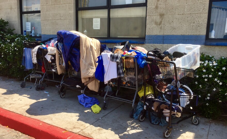 Carts loaded with people's belongings are parked in front of the Neil Good Day Center for the homeless on 17th Street, July 6, 2017.