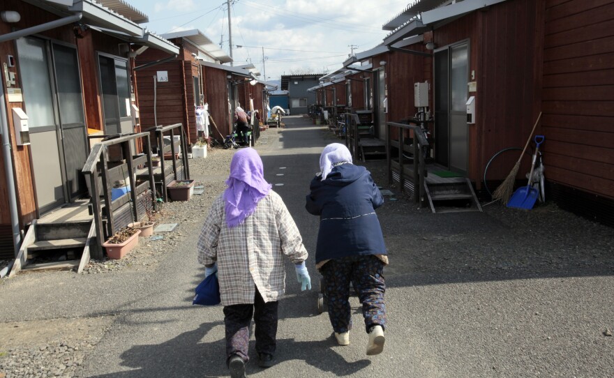 Elderly women walk together to go to their home in Fukushima prefecture.