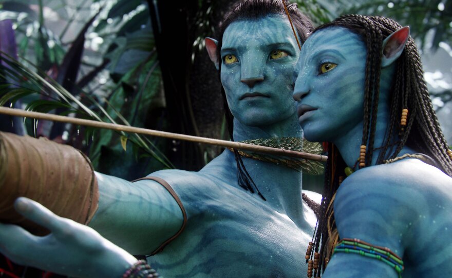 Sam Worthington (in Na'vi form) and Zoe Saldana in "Avatar."