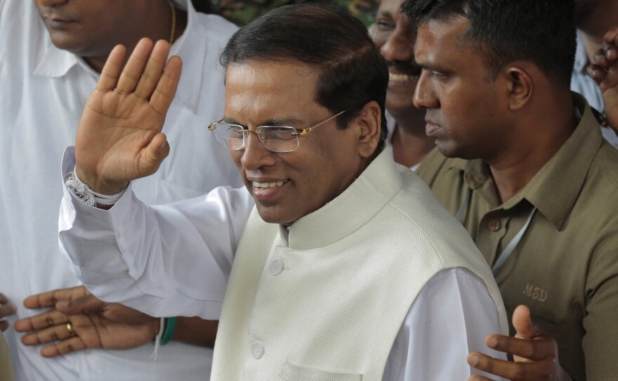 Sri Lankan President Maithripala Sirisena waves to supporters shortly after his election earlier this month. Sirisena looks to be trying to turn a new page in the island nation, which defeated a protracted insurgency in 2009.