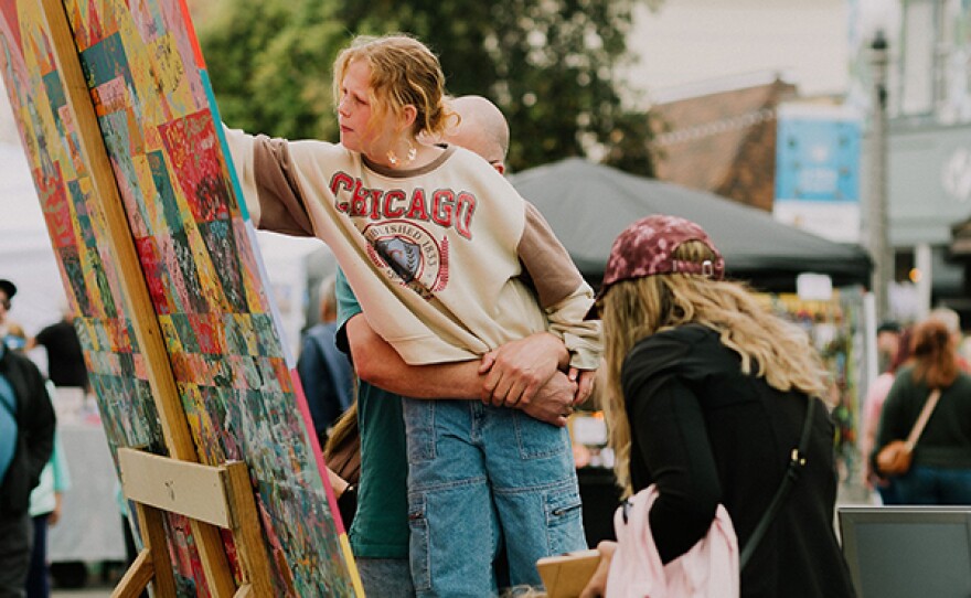 A family creating art at San Diego Made Holiday Market