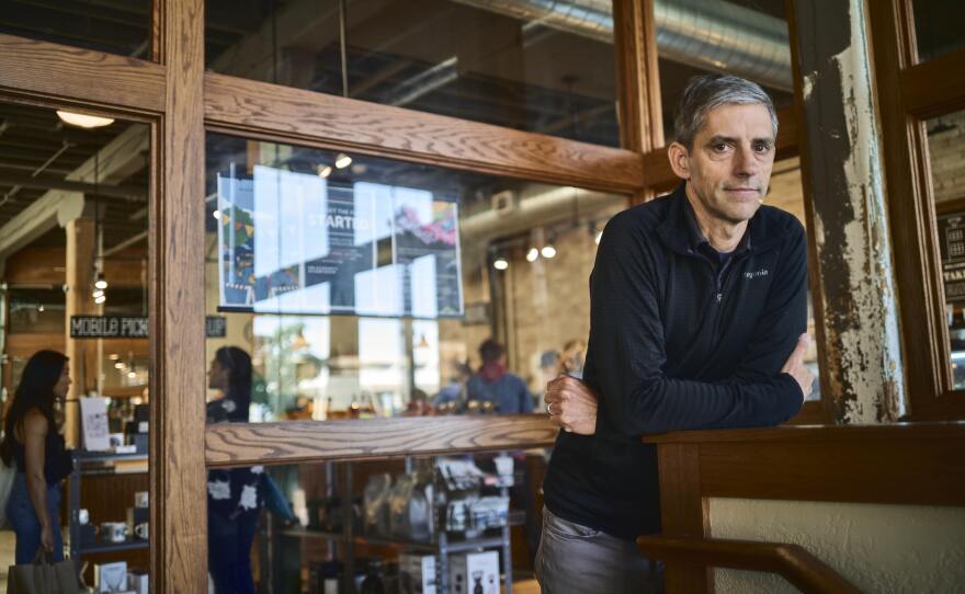 Eric Resch, founder of Stone Creek Coffee, stands inside his Factory Café in downtown Milwaukee. His company's slogan is "Never stop learning."