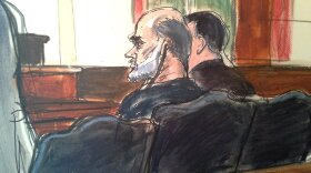 In this courtroom drawing, Osama bin Laden's son-in-law, Sulaiman Abu Ghaith, center, listens to a translator, in U.S. federal court on Wednesday in New York.