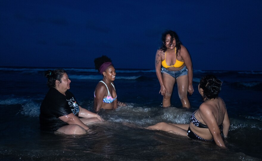 Cecilia Estrada, Odalys Gonzalez, Alitzel Diaz and Jessica Tomas after the Afro-Mexican women's meeting, rest on Tamiahua beach at sunset on July 23.