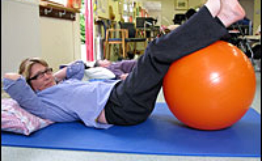 Linda Oatley takes part in a weekly group physical therapy session at the Chilterns MS Centre in Buckinghamshire, England.
