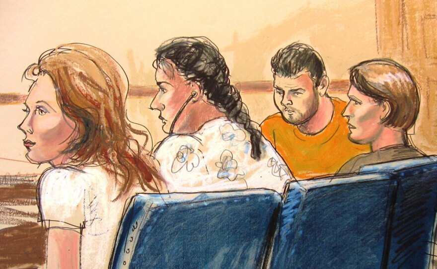 In this courtroom sketch, some of the defendants are seen in Manhattan federal court in New York on Monday. They are among 11 people the FBI has arrested for allegedly serving for years as secret agents of Russia's intelligence agency, the SVR, with the goal of penetrating U.S. government policymaking circles.