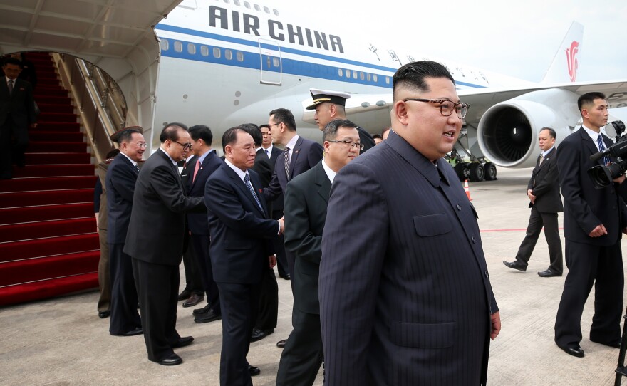 In this handout provided by Ministry of Communications and Information of Singapore, North Korean leader Kim Jong Un arrives in Singapore on June 10, 2018.