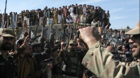 Militia members brandish weapons while dancing in a show of force in Khar, the main town in the tribal enclave of Bajaur, which lies in Pakistan's tribal area along the Afghan border. The men had gathered to show their numbers during a media trip organized by the Pakistani army. The army routed militants from Bajaur in fierce fighting that left some 75 militants dead. It's the latest Pakistani offensive that has been lauded by the United States.