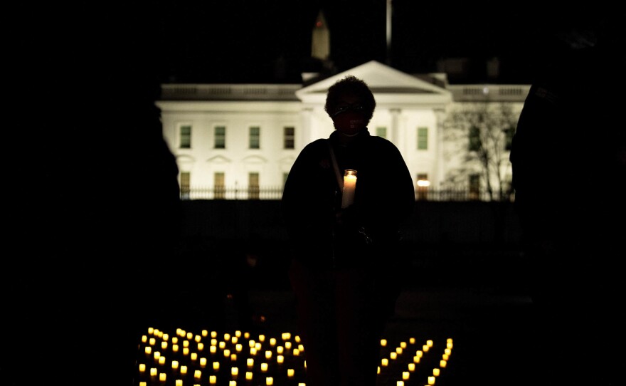 A candlelight vigil in Washington, D.C., in January 2022 honors nurses who died during the COVID-19 pandemic.