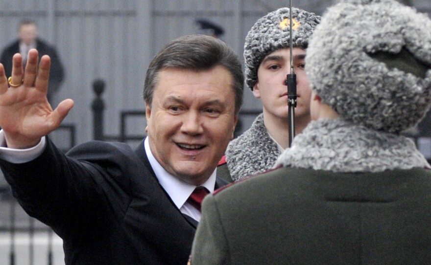 Viktor Yanukovych waves to his supporters before being sworn in as Ukraine's president in 2010.
