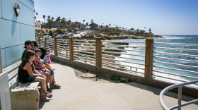 Edher Perez and Brenda Aguirre, with their children Brianna Venzor, Allison Perez and Aislinn Perez sit on a bench in La Jolla, 2017. 