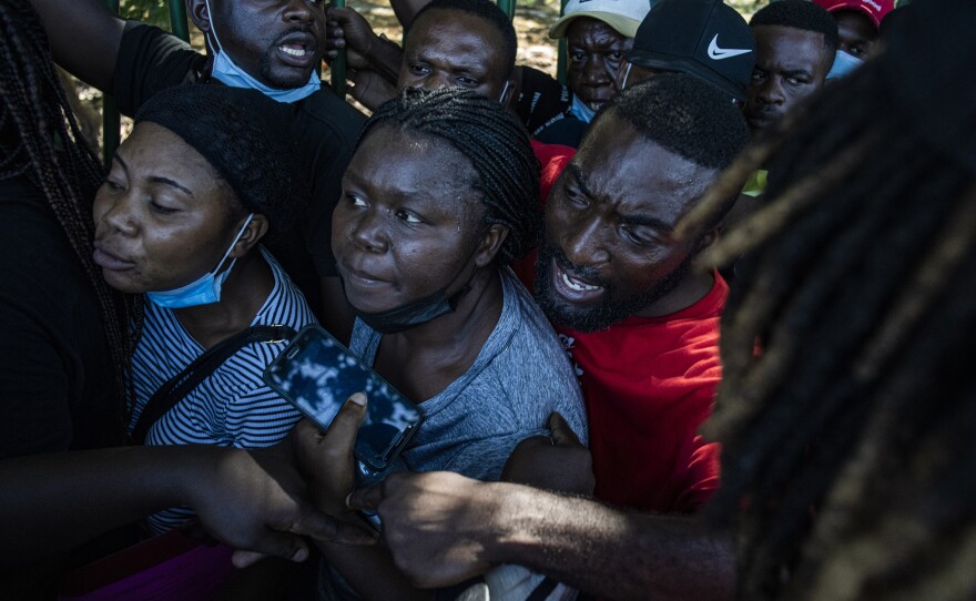 Haitian migrants jockey for position in line once they learn that there will no more buses for the rest of the day, outside the Mexican city of Tapachula, near the country's southern border with Guatemala. Decades of political and economic instability have led Haitians to leave their country seeking better lives abroad.