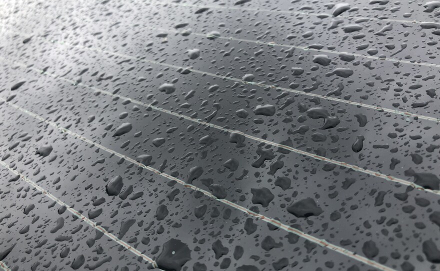 Rain drops are seen on a car window in the Allied Gardens neighborhood of San Diego, Calif. Dec. 14, 2021.