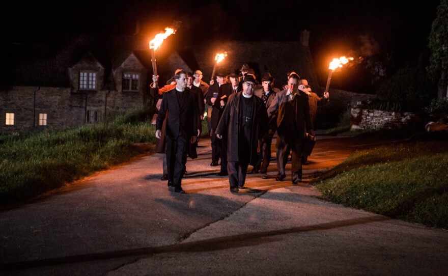 Rev. Peter Allsworthy (OLIVER GILBERT) and Rev. Adam Gillespie (JOHN SESSIONS) charge towards the witches in a scene from "The Eve Of St John."